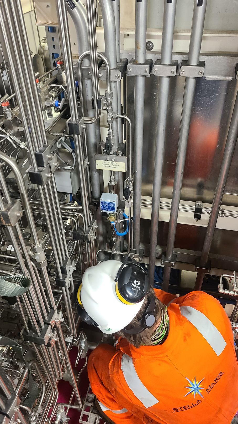 image of a Stella Maris professional engineer working on equipment