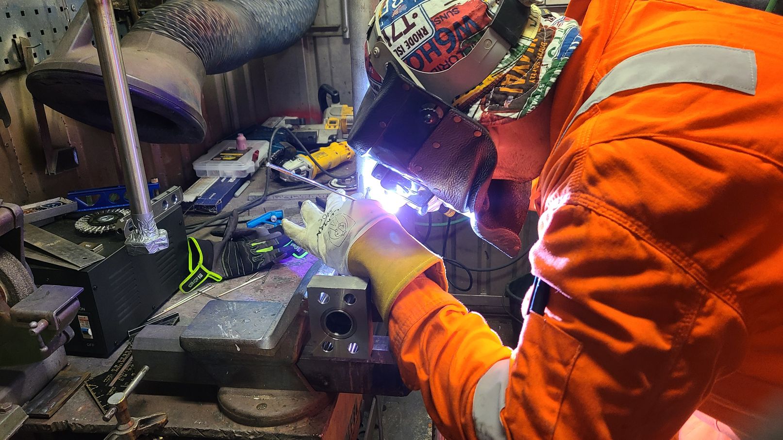 image of a machinist working on custom hydraulic equipment