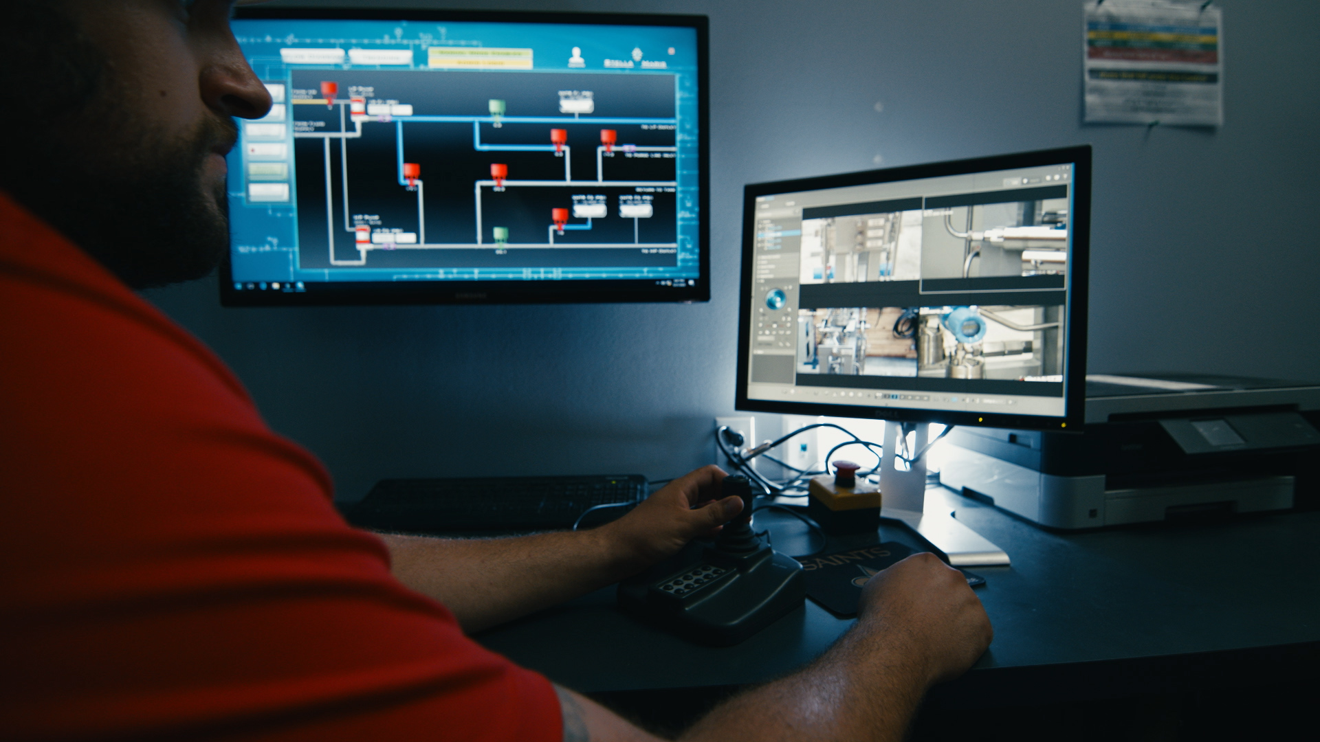 image of a person working on blue prints for a custom manufactured oil and gas system